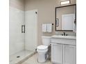 Modern bathroom with glass-enclosed shower, white vanity, and minimalist design at 1045 Zelkova Ln, Chapel Hill, NC 27517