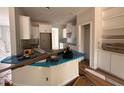 Spacious kitchen featuring white cabinets, an island, and ample counter space at 105 Tuskeegee Dr, Smithfield, NC 27577