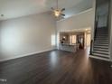 Spacious living room with hardwood floors, high ceilings, a fan, and an open floorplan at 106 Roma Gora Ct, Princeton, NC 27569