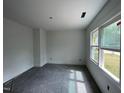 Bedroom with plush gray carpet and natural light at 112 Remington Woods Dr, Wake Forest, NC 27587
