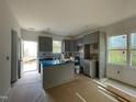 Spacious kitchen with island and plenty of cabinet space at 112 Remington Woods Dr, Wake Forest, NC 27587