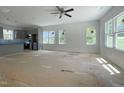Open-concept living room and kitchen boasts abundant natural light and modern finishes at 112 Remington Woods Dr, Wake Forest, NC 27587