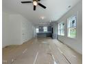 Open layout showcases the living room and kitchen area with a stylish island at 112 Remington Woods Dr, Wake Forest, NC 27587
