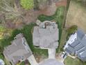 Birds-eye view of home and backyard, showing landscaping, patio, and fire pit at 113 Woodland Ridge Ct, Cary, NC 27519