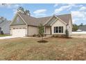 Beautiful single-Gathering home featuring a two-car garage, neutral siding, and well-maintained landscaping at 125 Prosecco Dr, Princeton, NC 27569