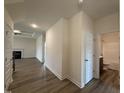 Bright hallway leads to the living area with fireplace and bathroom featuring modern fixtures at 141 Trescott St, Smithfield, NC 27577
