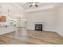 Bright living room with a fireplace and open floor plan, featuring hardwood flooring at 141 Trescott St, Smithfield, NC 27577