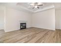 Spacious living room with hardwood flooring, a fireplace, and coffered ceilings at 141 Trescott St, Smithfield, NC 27577