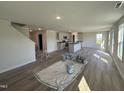 Large living room featuring new vinyl floors, light-colored paint, and plenty of space for Gathering gatherings at 18 W Emily Gardens Dr, Selma, NC 27576