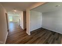 Bright and airy living room featuring stylish wood floors and neutral paint, perfect for relaxation and entertaining at 18 W Emily Gardens Dr, Selma, NC 27576