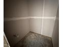 A bathroom under construction with gray walls, white trim, and fixtures for a sink and toilet at 18 W Emily Gardens Dr, Selma, NC 27577
