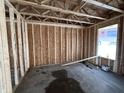 A view of the bedroom shows the wooden framing, an open window for natural light, and a clean, spacious layout at 18 W Emily Gardens Dr, Selma, NC 27577