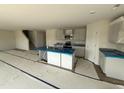 Bright kitchen featuring granite countertops, modern appliances, an island with a sink, and an open layout at 18 W Emily Gardens Dr, Selma, NC 27577