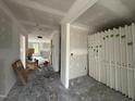Spacious living room under construction with newly installed drywall, electrical wiring and bare concrete flooring at 18 W Emily Gardens Dr, Selma, NC 27577