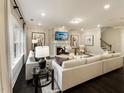 Cozy living room with a fireplace, comfortable seating, and stylish decor at 205 E Fountainhead Ln # 159, Garner, NC 27529