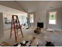 Bright living room with fireplace and windows with lots of natural light at 221 Tee Dr, Selma, NC 27576