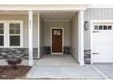 Covered front porch with stylish columns and stone accents enhance this beautiful home at 231 Trescott St, Smithfield, NC 27577