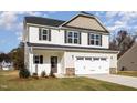 Attractive two-story home with a two-car garage and a well-manicured lawn at 246 Trescott St, Smithfield, NC 27577