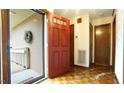Inviting home entrance with a vibrant red door and ramp access for easy entry at 2765 Rue Sans Famille, Raleigh, NC 27607