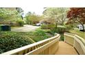 Beautiful exterior view of the home featuring lush landscaping and a convenient ramp at 2765 Rue Sans Famille, Raleigh, NC 27607