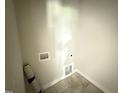 Bright laundry room featuring tile floors and hookups at 28 Bailey-Boykin Rd, Selma, NC 27576