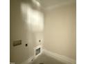 An unfinished laundry room with washer and dryer hookups at 28 Bailey-Boykin Rd, Selma, NC 27576