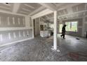 Unfinished living room featuring modern white cabinets and a spacious layout, awaiting personalized touches at 28 Bailey-Boykin Rd, Selma, NC 27576