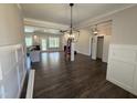 Open-concept living room boasts hardwood floors, recessed lighting and stylish fixtures at 28 Bailey-Boykin Rd, Selma, NC 27576