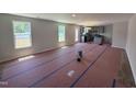 Spacious living room with abundant natural light and views of the backyard and open access to the kitchen at 33 W Emily Gardens Dr, Selma, NC 27576