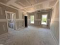 Bedroom bathed in natural light with large windows and trim detail at 40 Bailey-Boykin Rd, Selma, NC 27576