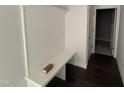 Functional entryway featuring custom bench seating, shiplap accent wall, and convenient closet access at 40 Bailey-Boykin Rd, Selma, NC 27576