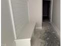 Hallway featuring a built-in bench with a modern, functional design and access to other rooms at 40 Bailey-Boykin Rd, Selma, NC 27576