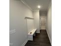 Hallway with a built-in bench and coat rack, offering a practical and stylish entryway at 40 Bailey-Boykin Rd, Selma, NC 27576