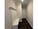 Entryway featuring built-in bench and storage leading from the garage at 40 Bailey-Boykin Rd, Selma, NC 27576