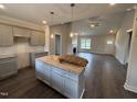 Open concept kitchen with a center island, granite countertops, and modern grey cabinetry at 40 Bailey-Boykin Rd, Selma, NC 27576