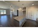 Eat-in kitchen featuring granite countertops, stainless appliances, and pendant lighting at 40 Bailey-Boykin Rd, Selma, NC 27576