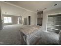 Well-lit open kitchen and living space showcasing modern design elements at 40 Bailey-Boykin Rd, Selma, NC 27576
