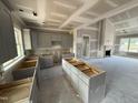 Kitchen with unfinished cabinets and island open to the living room at 40 Bailey-Boykin Rd, Selma, NC 27576