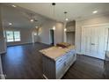 Open-concept kitchen with an island, stainless steel appliances, and modern cabinetry at 40 Bailey-Boykin Rd, Selma, NC 27576