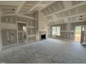 Living room featuring a fireplace and abundant natural light at 40 Bailey-Boykin Rd, Selma, NC 27576