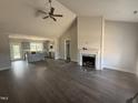 Bright living room features high ceilings, a modern fireplace, and seamless flow to the kitchen at 40 Bailey-Boykin Rd, Selma, NC 27576