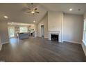 Spacious living room featuring hardwood floors, a fireplace, and an open-concept design at 40 Bailey-Boykin Rd, Selma, NC 27576