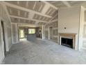 Spacious living room with fireplace and open-concept design at 40 Bailey-Boykin Rd, Selma, NC 27576