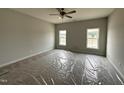 Bright bedroom with plush carpeting and two large windows offering plenty of natural light at 40 Tuskeegee Dr, Smithfield, NC 27577