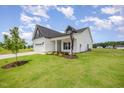 Beautiful home with a well-kept lawn and landscaping at 40 Tuskeegee Dr, Smithfield, NC 27577