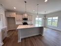 Beautiful kitchen featuring stainless steel appliances, a center island, pendant lighting, and a breakfast area at 40 Tuskeegee Dr, Smithfield, NC 27577