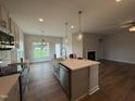 Kitchen with stainless steel appliances, center island, and pendant lighting at 40 Tuskeegee Dr, Smithfield, NC 27577