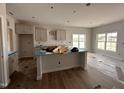 Bright, spacious kitchen with a central island, ample natural light, and modern design at 40 Tuskeegee Dr, Smithfield, NC 27577