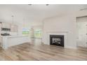 Bright open floor plan with fireplace and luxury vinyl plank flooring at 40 Tuskeegee Dr, Smithfield, NC 27577