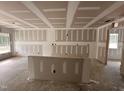 Bright living space showcases an open concept with large windows and unfinished construction at 41 W Emily Gardens Dr, Selma, NC 27576